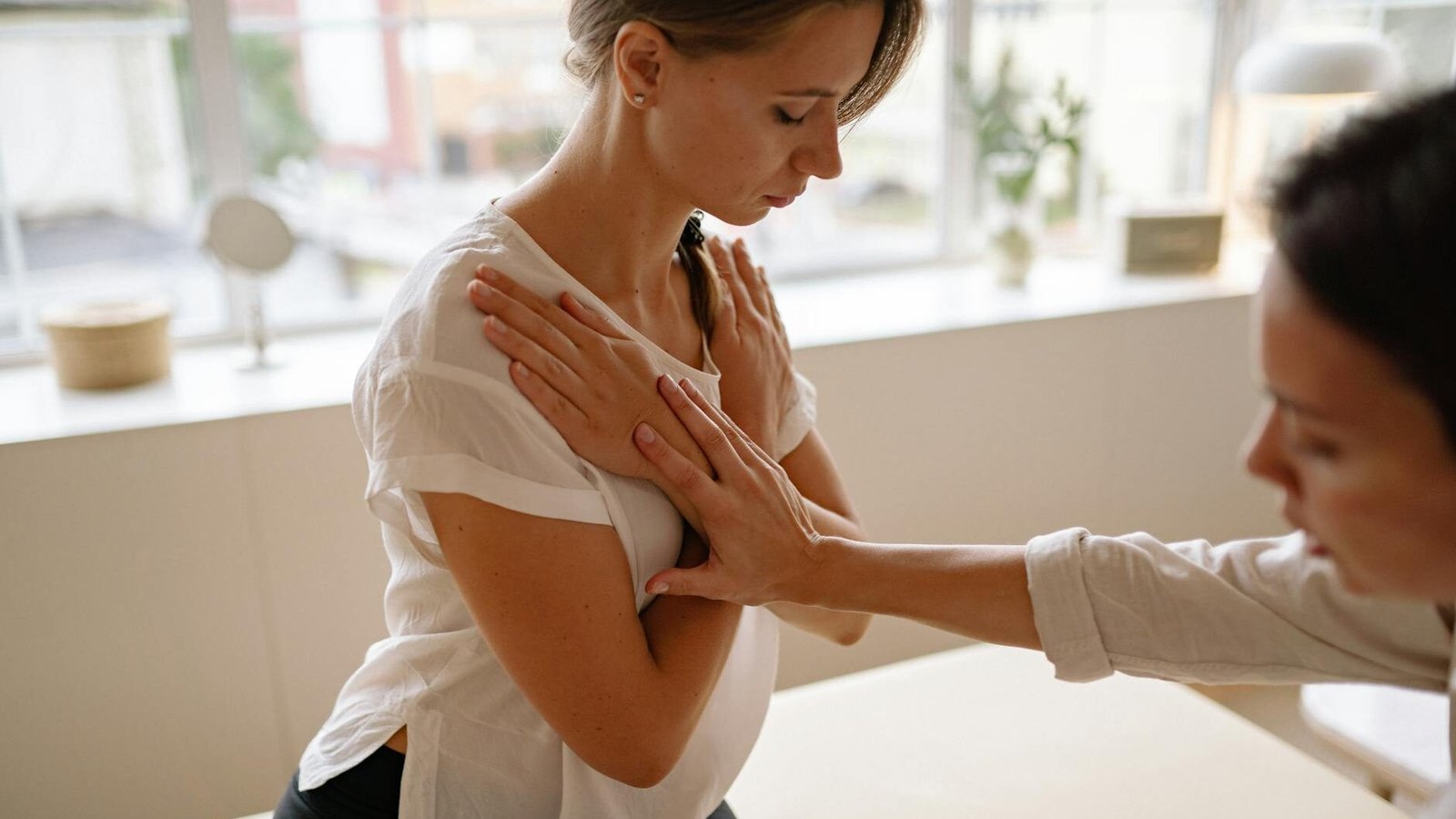 a woman with her hands crossed on chest